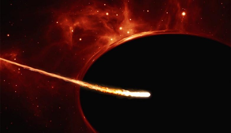 Ilustração que mostra uma estrela de baixa-massa a ser engolida por um buraco negro super-massivo. 
